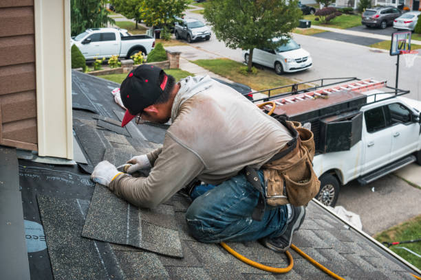 Professional Roofing technician working in Hampton, IA